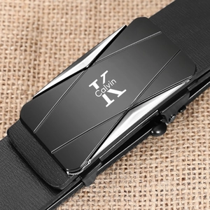 Close-up of a silver alloy automatic buckle on a black leather belt with textured finish