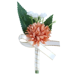 Artificial orange-pink dahlia wedding boutonniere with white ribbon and green leaves