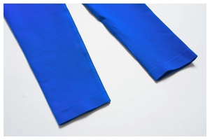 Macro shot of high-elasticity blue yoga pants featuring durable flatlock seam stitching