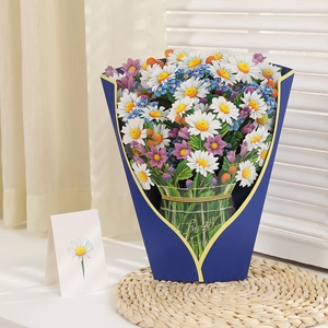 3D pop-up greeting card featuring a vibrant bouquet of daisies in a blue paper vase