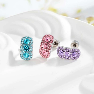 Three minimalist geometric cartilage stud earrings with light sea blue and pink zircons