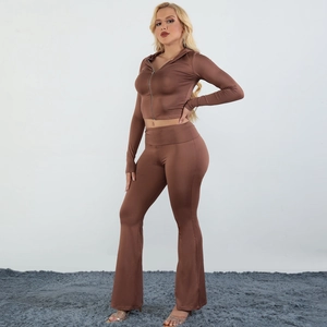 Detail of a brown two-piece women's set with a zip hoodie and flared yoga pants