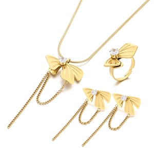 Elegant gold stainless steel jewelry set with bowknot tassels and sparkling zircon accents