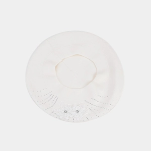 Detail of white knitted beret featuring elegant floral applique and sparkling rhinestones