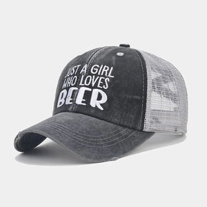 Detailed close-up of vintage trucker hat with Just A Girl Who Loves Beer embroidery