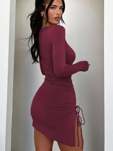 Detail view of the side drawstring ruching on a burgundy long sleeve bodycon dress