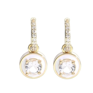 Detailed close-up of gold plated round drop earrings with white enamel and clear crystals