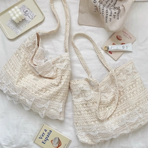 Detail of crochet tote bags with elegant lace layers and intricate hollow patterns