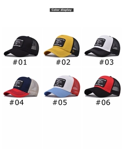 Mesh trucker hat collection showing six color variants with funny fish embroidery patch