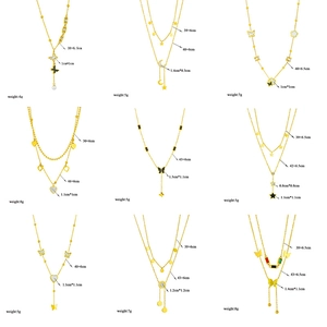 Collection of nine gold titanium steel layered necklaces with butterfly and star pendants