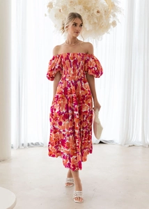 Detail of floral off-shoulder dress with puff sleeves and smocked bodice pattern