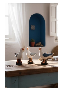 Detailed view of Mediterranean resin seagull statues with realistic matte finish