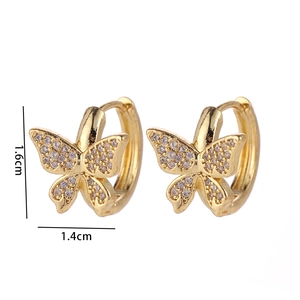 Detail view of gold butterfly hoop earrings with white zircon measuring 1.6cm by 1.4cm