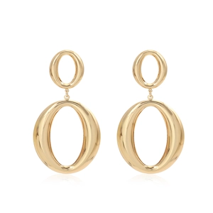 Macro detail of double oval gold dangle earrings with polished mirror finish