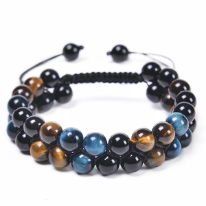 Macro detail of double-layer bracelet with blue tiger eye stone and black onyx beads