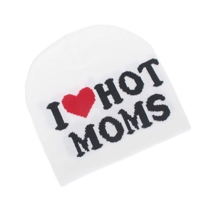 Detail of white knit beanie featuring I Love Hot Moms slogan and heart pattern design