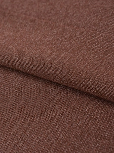 Macro shot of brown metallic knit fabric showing detailed yarn texture and shimmer