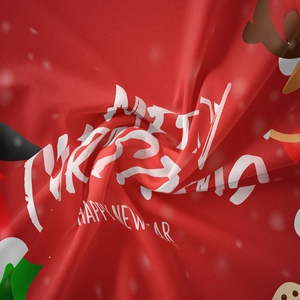 Close-up of red Christmas tapestry fabric with white Merry Christmas reindeer print