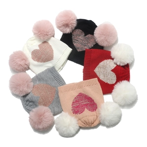 Winter knit hats for girls with double faux fur pom-poms and sequin heart design