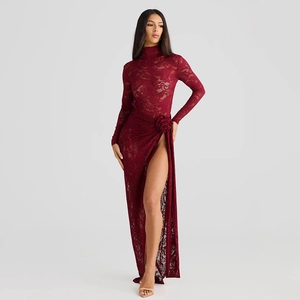Detail of red lace dress showing high neck and elegant floral accent on the side slit