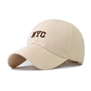 Beige cotton baseball cap with dark brown NYC embroidery on a clean white background