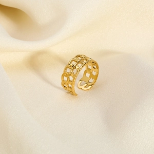 Detail of 18K gold plated double-layer Cuban chain ring on white satin background
