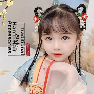 Detail of Hanfu hair clips with red flowers, painted butterflies and pearl tassels