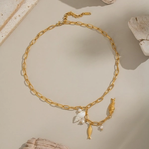 Elegant gold necklace with natural white shell, freshwater pearls and koi fish charms