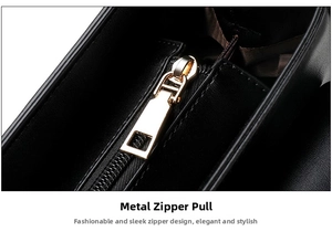 Close-up of polished gold-toned metal zipper pull on a premium black leather shoulder bag