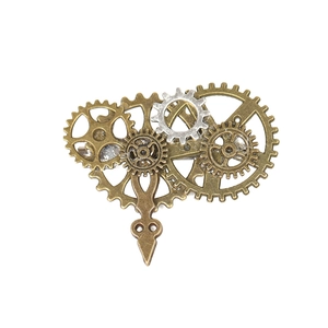 Steampunk gear wing brooch in bronze and silver metal tones on a white background