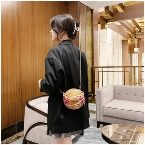 Fashionable basketball-shaped crossbody bag with colorful graffiti and gold chain strap