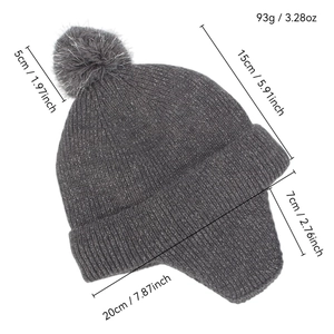 Dark grey knitted baby earflap hat with silver thread details and plush pom-pom