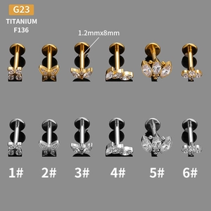 G23 Titanium olive leaf and crown cartilage stud earrings in gold and silver set