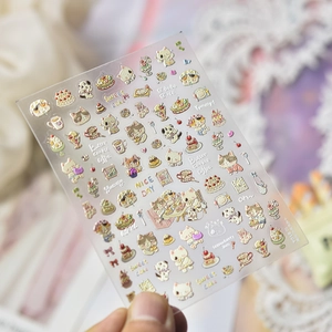 Detail of 3D embossed nail art stickers featuring sweet cats and dessert themes