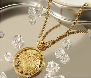 Macro view of golden 3D Jesus pendant with crown of thorns on a religious necklace