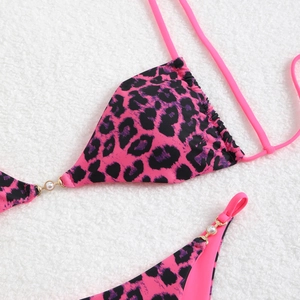 Sexy leopard print bikini top with pearl accents and metallic gold ring details