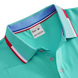 Close-up of turquoise polo shirt collar showing fabric texture and size M label