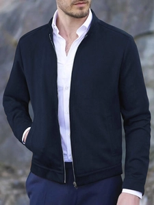 Detail of navy blue slim fit jacket showing the stand collar and silver metal zipper
