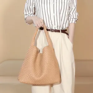 Handwoven beige leather tote bag with a large capacity and minimalist casual style