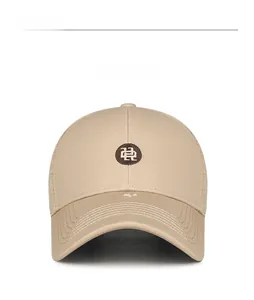 Detailed front view of a khaki cotton mesh baseball cap with vintage badge and embroidery