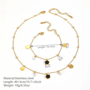 Golden stainless steel jewelry set with black clover pendants and clear crystal beads