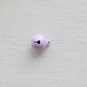 Detail of a 14mm purple painted metal bell with a crisp candy color finish and metal loop