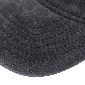 Detail view of reinforced stitching on washed cotton peak of charcoal baseball cap