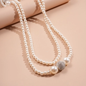 Elegant double-layer pearl necklace with sparkling rhinestone ball and vintage finish