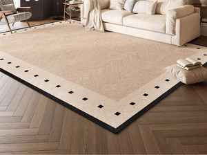 Detail of Sunset Glow French retro rug with geometric borders on dark wood floor