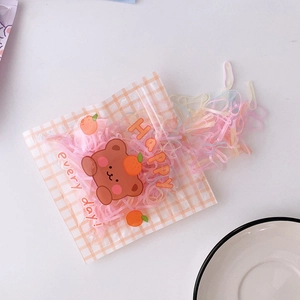 Pastel colorful elastic hair bands in a cute bear zip bag for girls and children