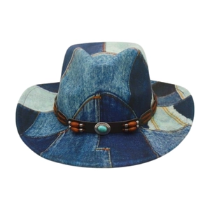 Close-up of vintage patchwork denim cowboy hat with leather band and turquoise stone