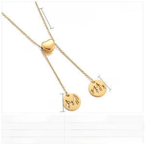Detail of gold stainless steel family necklace with hollow heart and circle charms