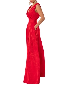 Detail of red sleeveless jumpsuit with deep V-neck, high waist, and side pockets