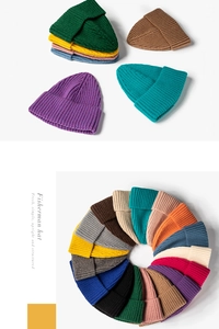 Detailed view of ribbed knit beanies in a vibrant palette of over fifteen distinct colors